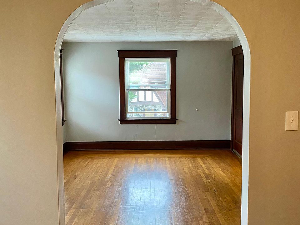 Beautiful arched doorway looking into the living room from the dining room.