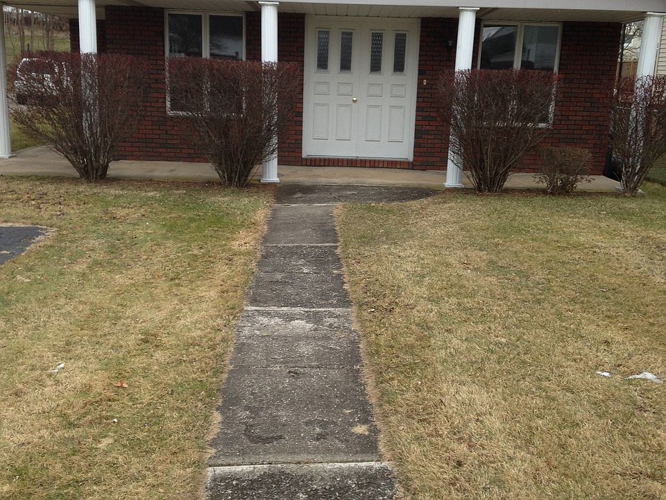 Front Yard/Porch with attached Driveway