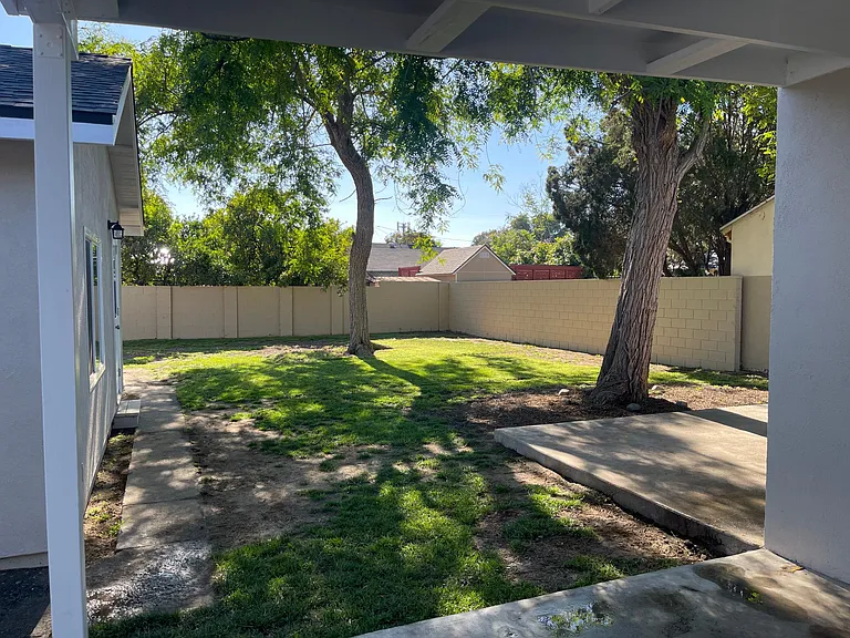 Large backyard with two patio areas. One large Covered Patio. Great for pets and entertaining.