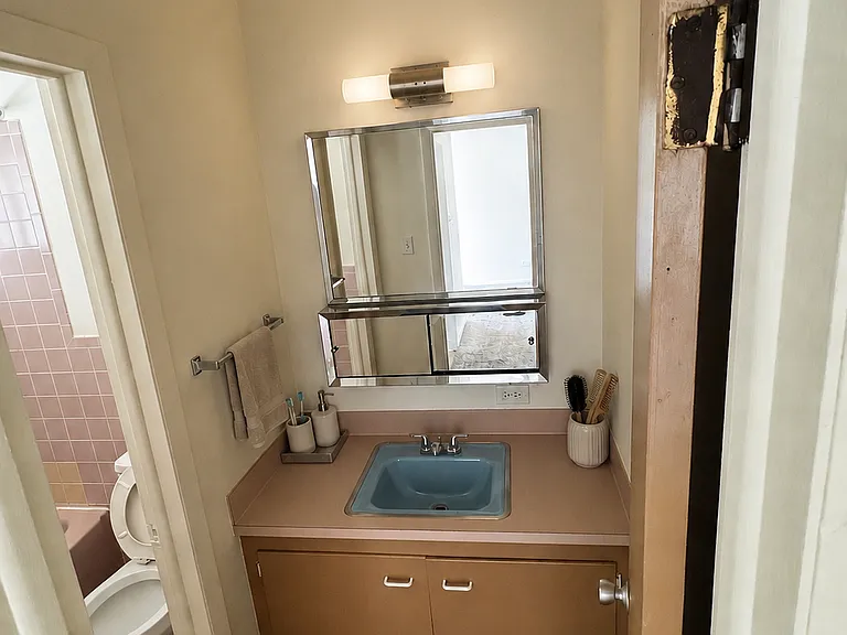 Bathroom vanity area with items added for decoration
