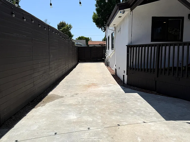 Long private driveway with an automatic remote-controlled gate