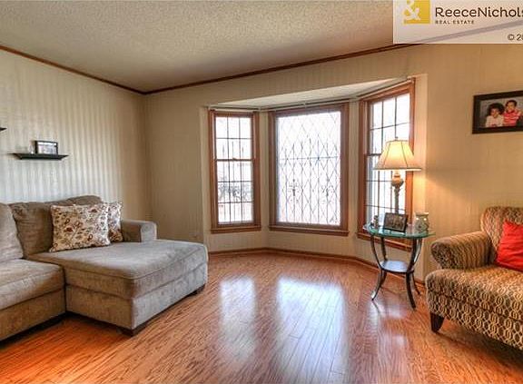 Light filled living room with hardwood floors.