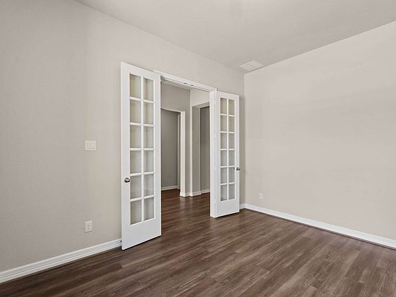 An additional view of the study and french doors.