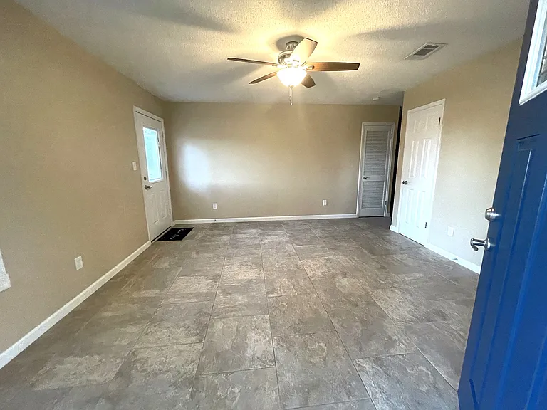 Living room view of hall and laundry room