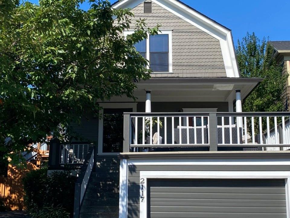 Front of house. Deck on top of garage.