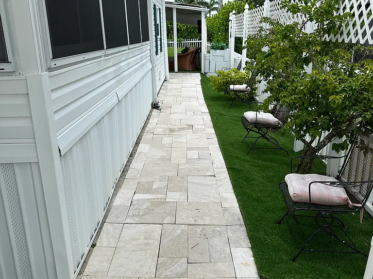 Marble slab walkway to back outdoor barbecue sitting area and workshop!