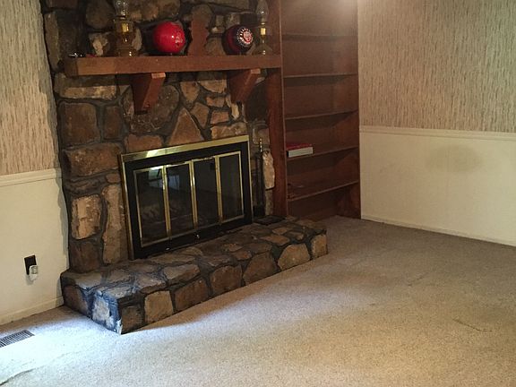 Den w/wood burning fireplace