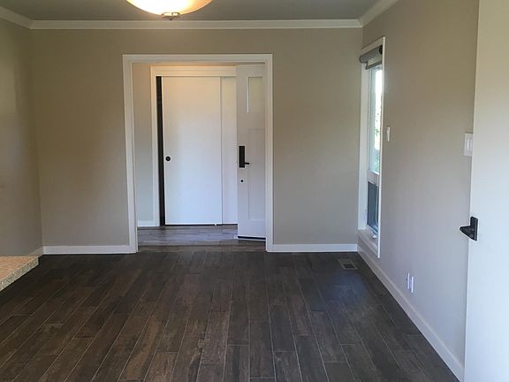 Den with porceline tile floor