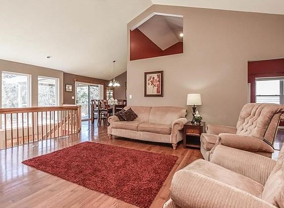 Fabulous Great Room with vaulted ceiling and wall of windows.