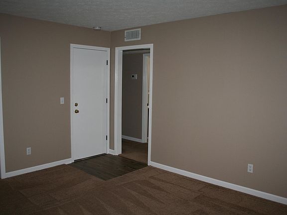 Living room (doorway leads to stairway down to garage/basement)
