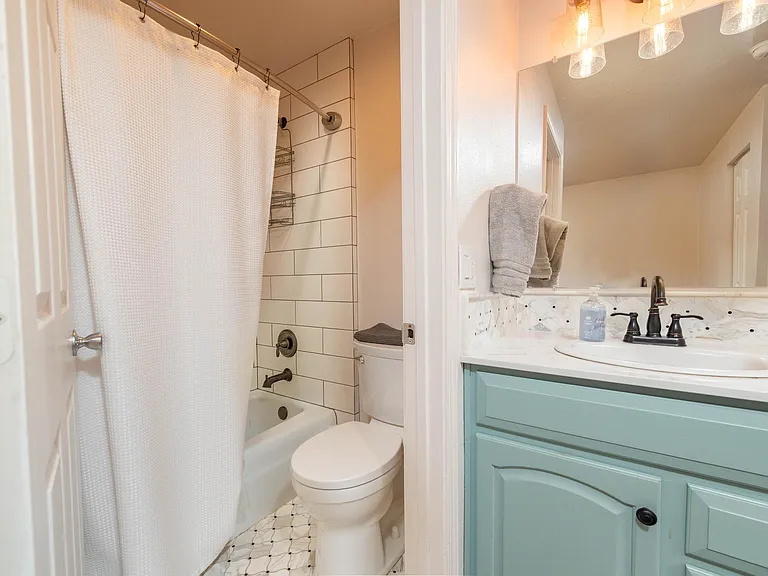 Full bathroom upstairs has shower/toilet and then separate vanity area to maximize usage.