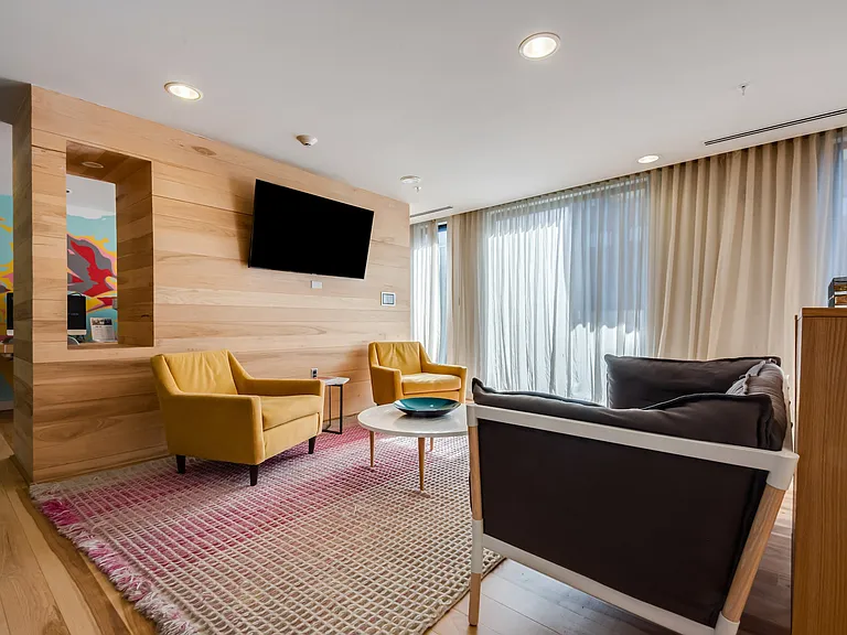 Lounge Corner Featuring Soft Lighting and Warm Wood Finishes