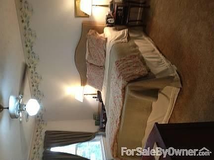 Master bedroom
						:
						Double window overlooks backyard and his and hers closets, en suite.