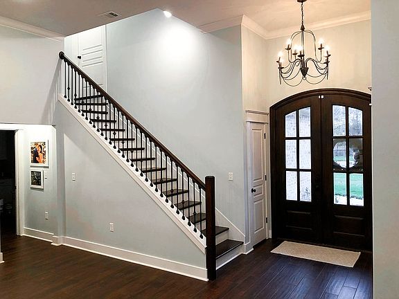 Front door and wooden stairs
