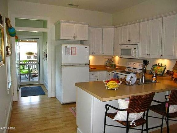 The kitchen is located in the main house. Under counter ligh