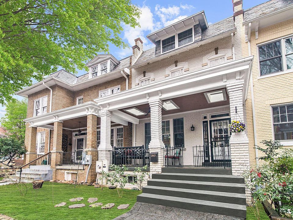Renovated Wardman rowhouse with spacious front porch and skylites!