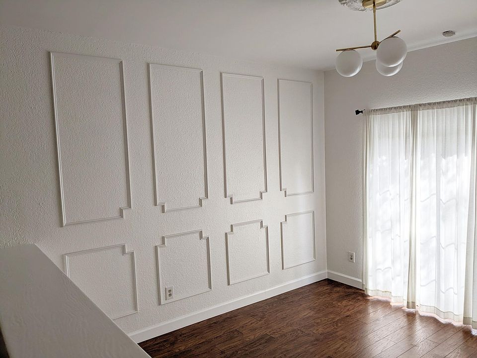 Sunken living room with high ceilings.