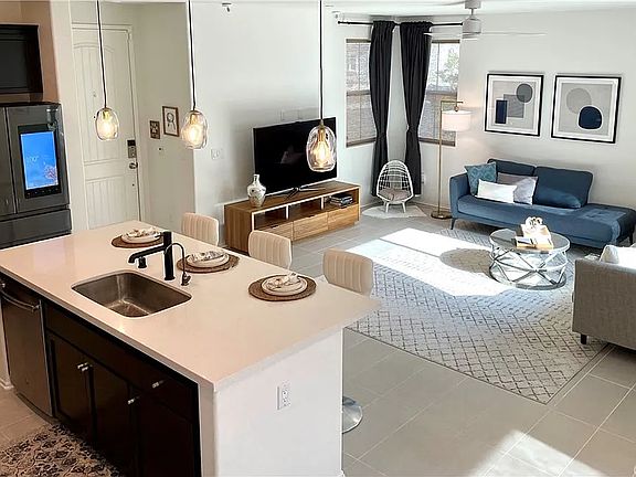 View of living room and kitchen from the staircase