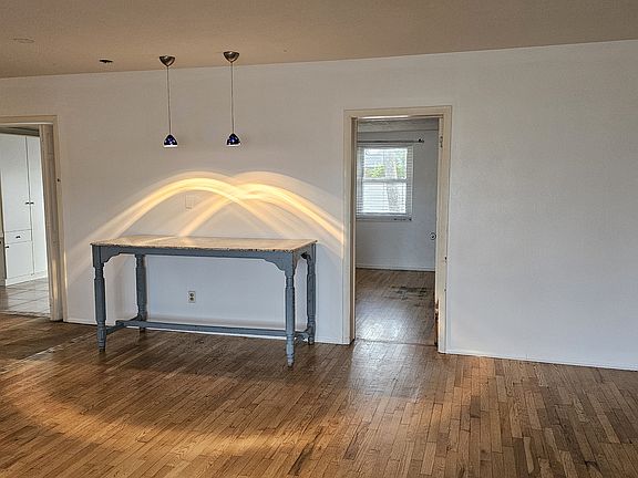Living room, large granite table, beautiful pendent lights with dimmer