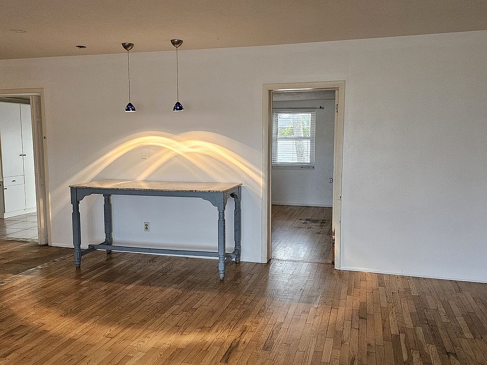 Living room, large granite table, beautiful pendent lights with dimmer