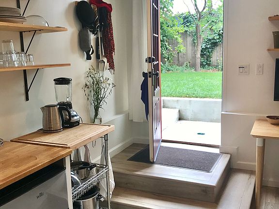 Entrance from the garden, with two steps down from the patio and two steps into the studio