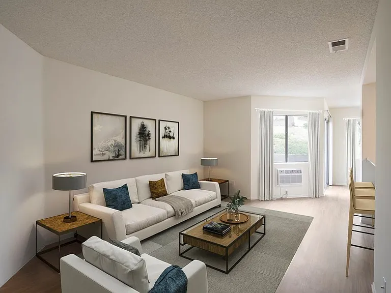 Renovated Package I living room with hard surface flooring