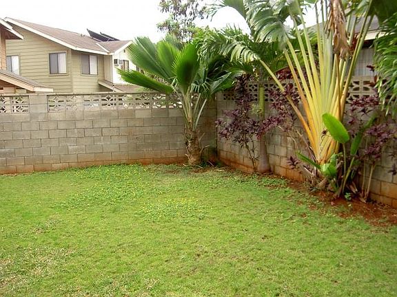 Backyard with inground sprinklers
