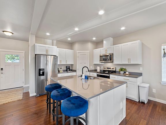 Stainless steel appliances, quartz countertops.