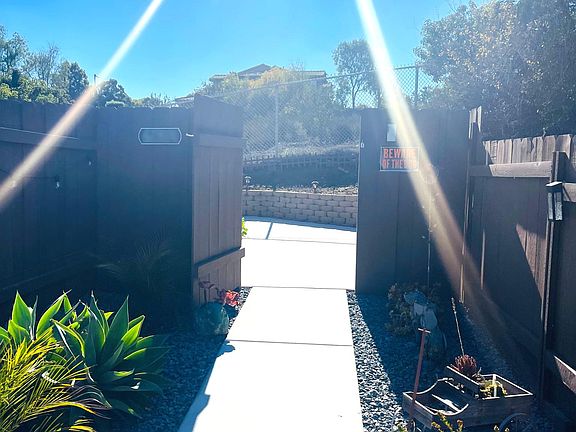 Walkway to private granny flat from Street, gate on the far end, opened in this picture, is actual entrance to granny flat patio area