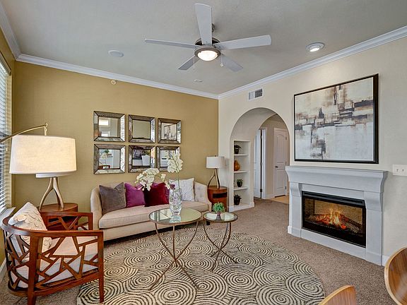 Tuscany Living Room with Fireplace and Ceiling Fan