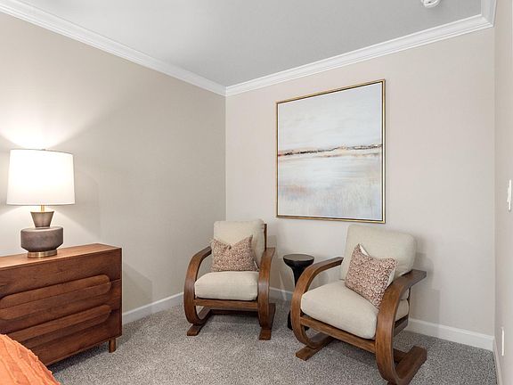 Create a reading nook or lounge space in the primary bedroom.