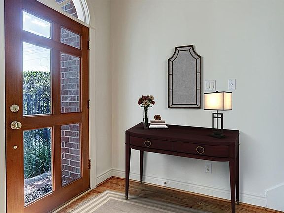 Lovely entry with natural light! Virtually staged.