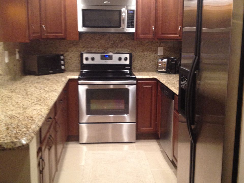 view of kitchen with granite top new cherry wood cabinets