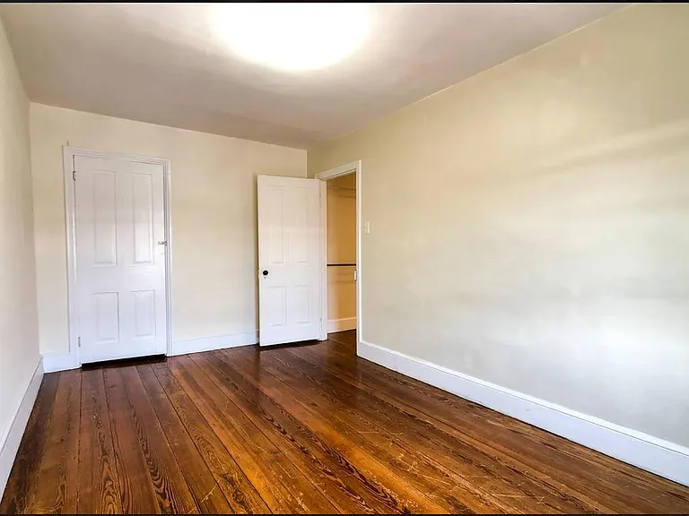 The 2nd-floor bedroom has been refreshed with refinished hardwood floors, a new ceiling fan, and a new window to fill the space with natural light. Updated listing photos coming soon!