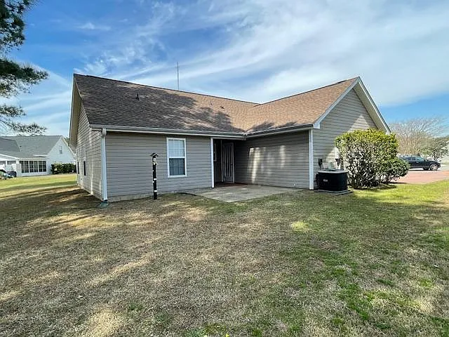 The side of the house offers a patio perfect for grilling and entertaining with some privacy.