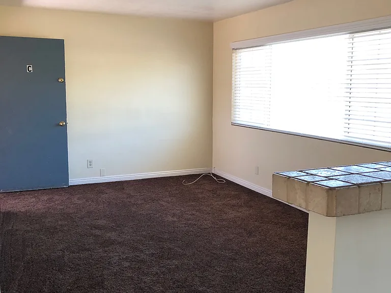 Spacious Living Room, Front entrance, Modern Blinds, extra large Window, new Carpet, newly painted.