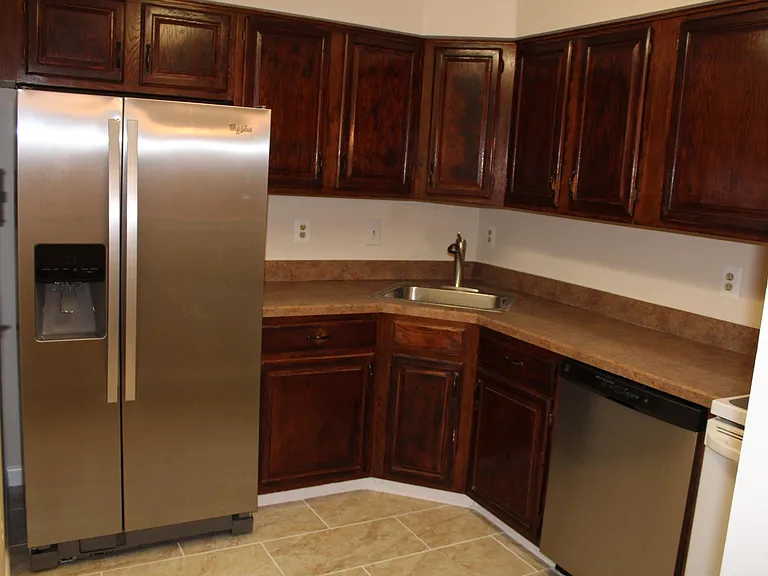 Kitchen with new refrigerator and dishwasher