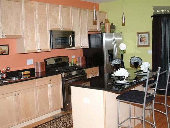 kitchen. Granite countertops. Microwave, Refrigerator, Dishwasher, GE 4 burners stove and oven.