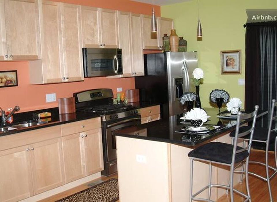 kitchen. Granite countertops. Microwave, Refrigerator, Dishwasher, GE 4 burners stove and oven.