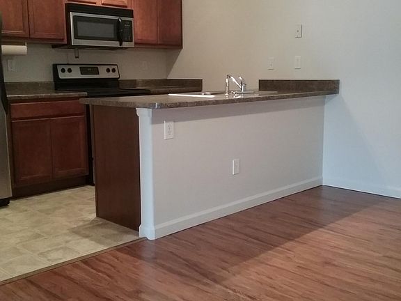 Ample dinning area - CARPET on dinning, living room and hallway (This picture shows an identical unit without carpet)