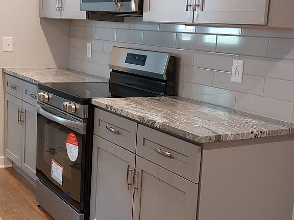 Large new kitchen, new cabinets, flooring, appliances, and granite counters!