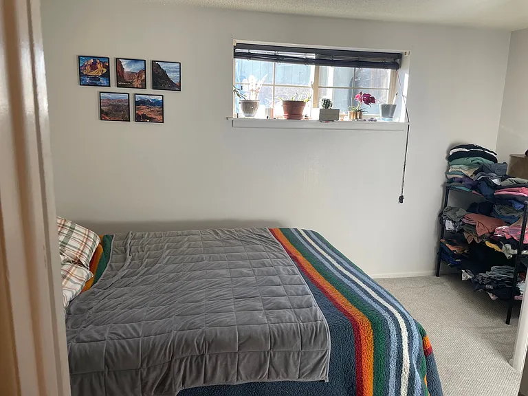 Bedroom with foam mattress is accessed from the kitchen