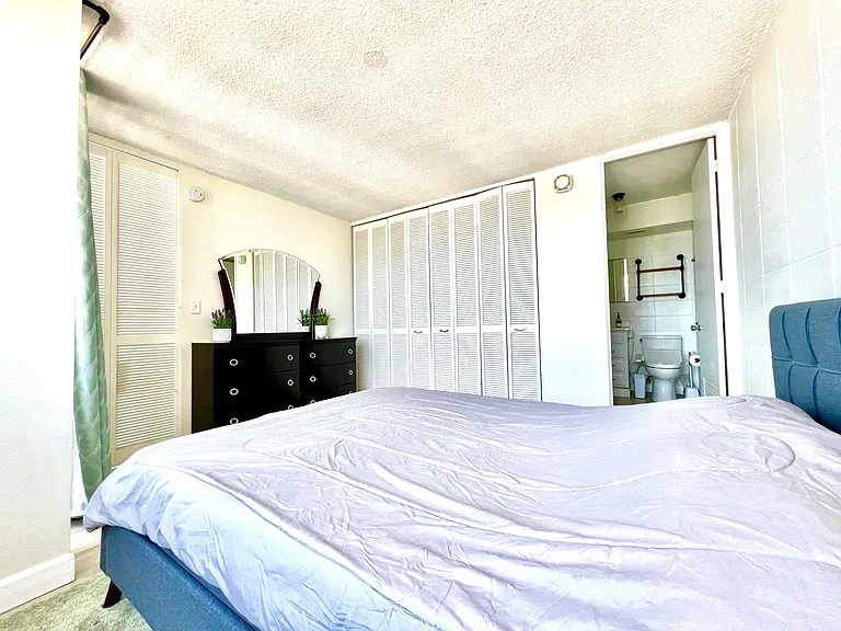Master bedroom with 6-drawer dresser and mirror
