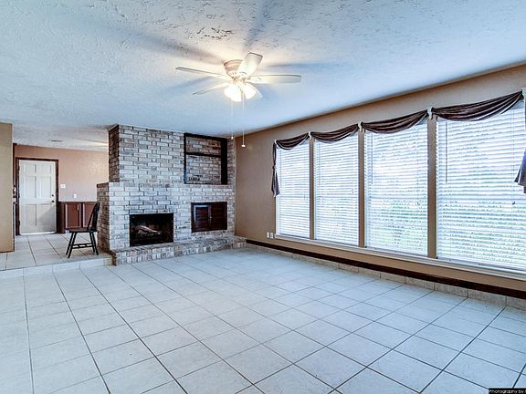 Spacious Family Den with Tile Flooring