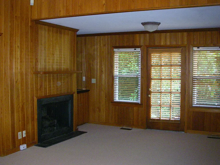 Fireplace not being used. Wet bar is next to the window in this view