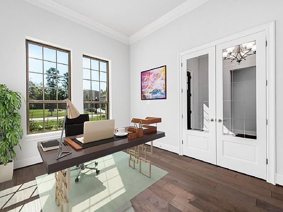 Double door entry and wood flooring in office, virtually staged for demonstration