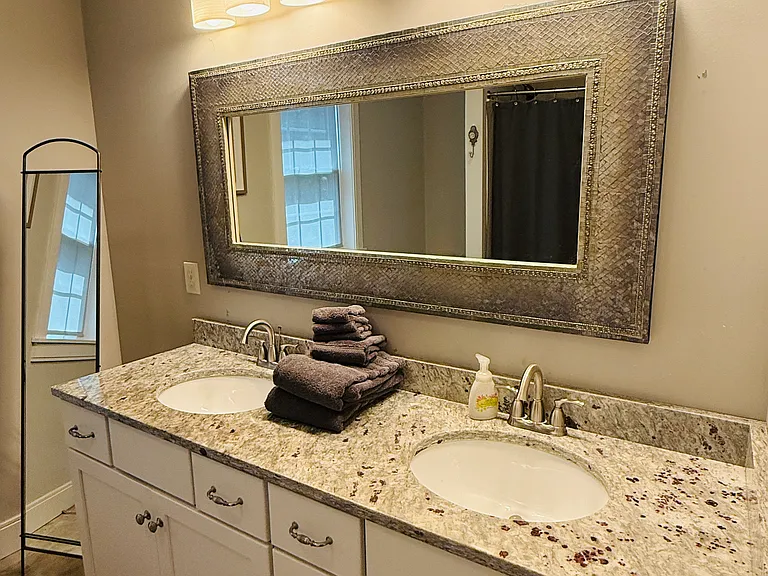 Attached master bath. Walk in shower with seating area within the shower.