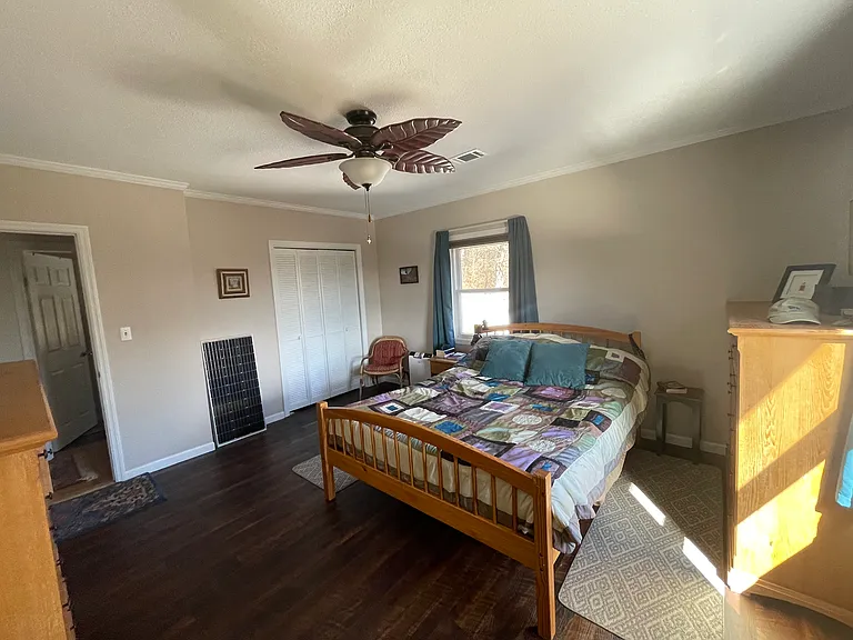 Master bedroom with views of the ridges and attached bathroom. Room easily accommodates a king size bed.
