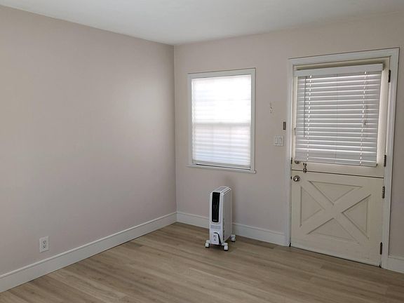 Office/ living space facing dutch door. Window with bright light.