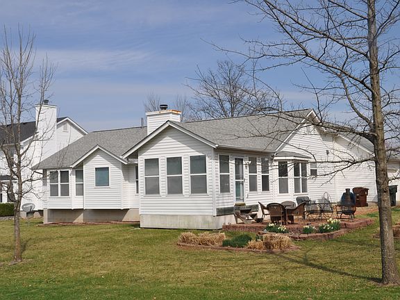 Back of house with sun room